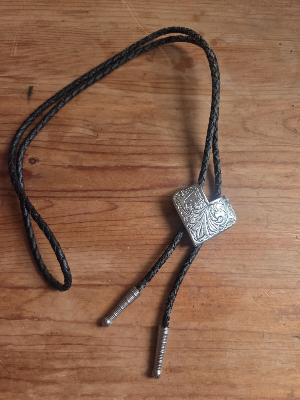 Vintage Western Braided Leather Bolo Tie with Engraved Silver Etched Leaf Design